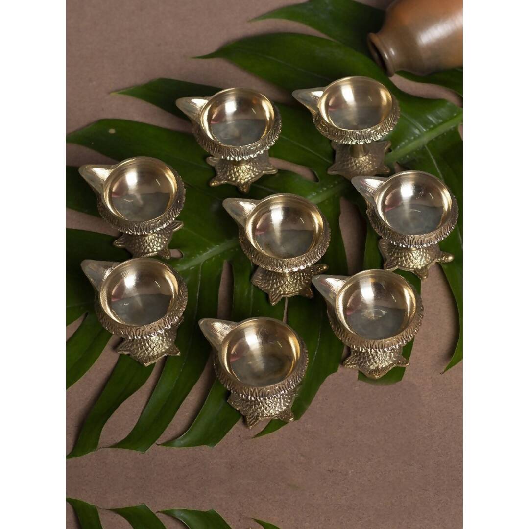 Buy Tied Ribbons Gold Toned 8 Pieces Decorative Brass Diyas With Tortoise Base